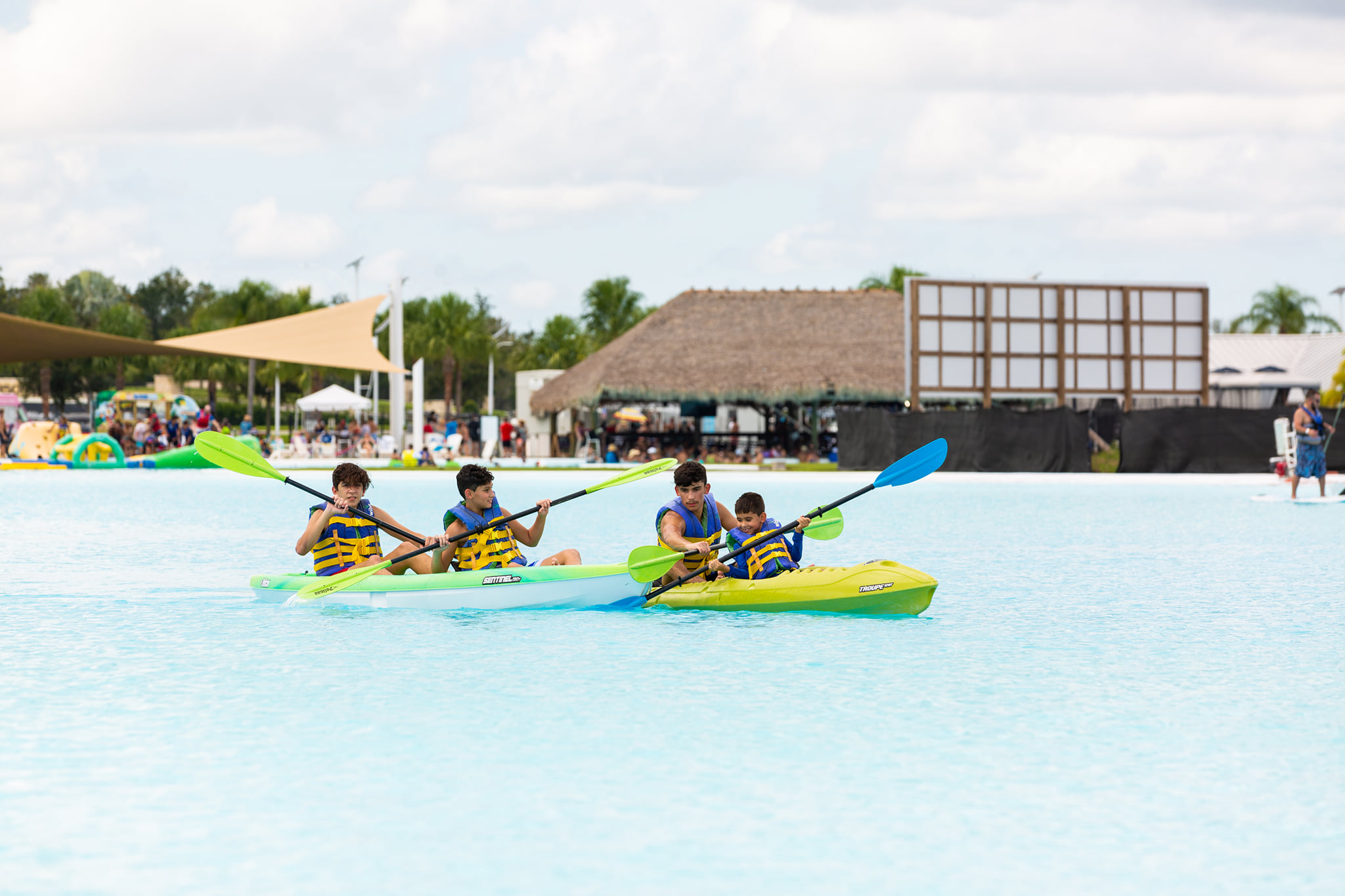 Four boys kayaking together on a Metro Lagoon