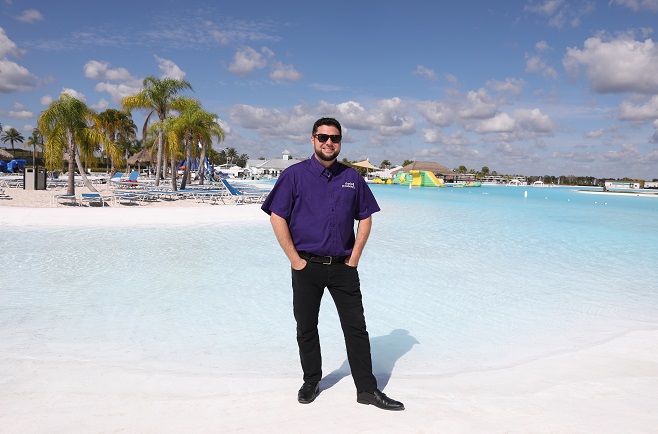 Man standing in front of lagoon area