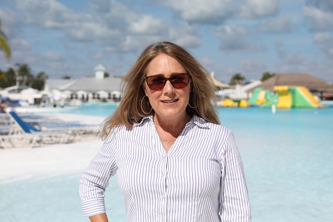 Woman standing in front of lagoon area