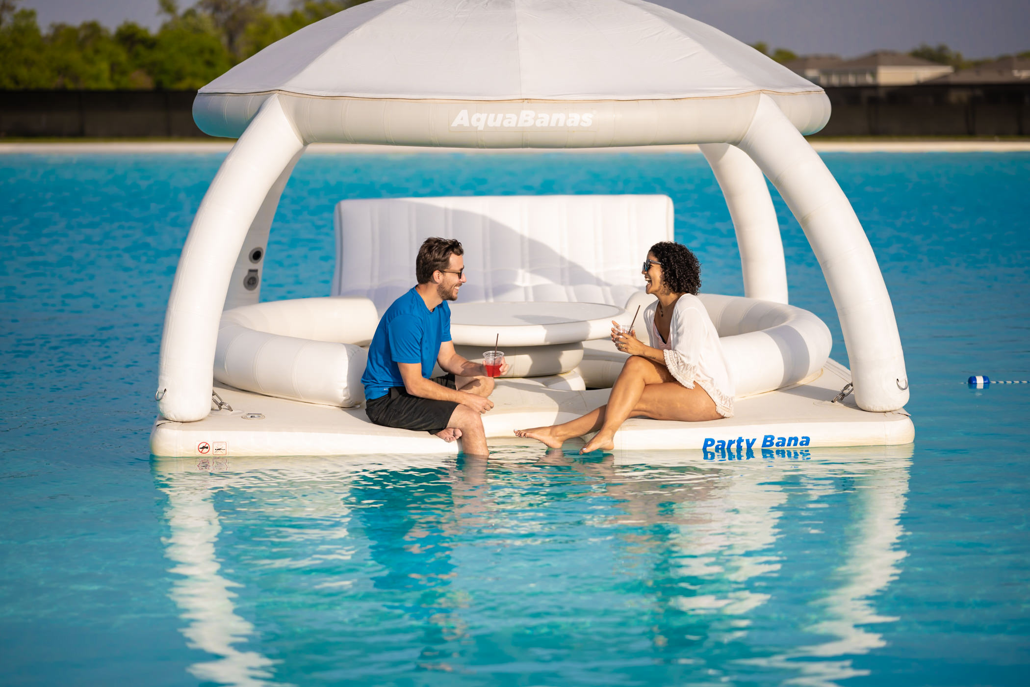 Couple enjoying a floating gazebo on a Metro Lagoon