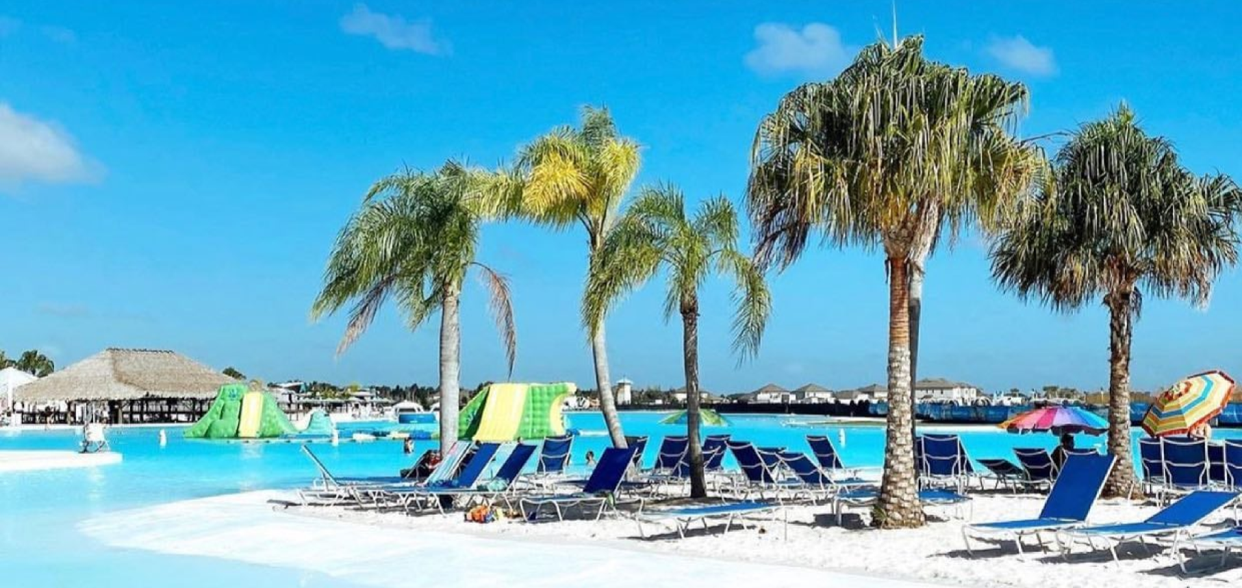 Lagoon area with lounge chairs and palm trees